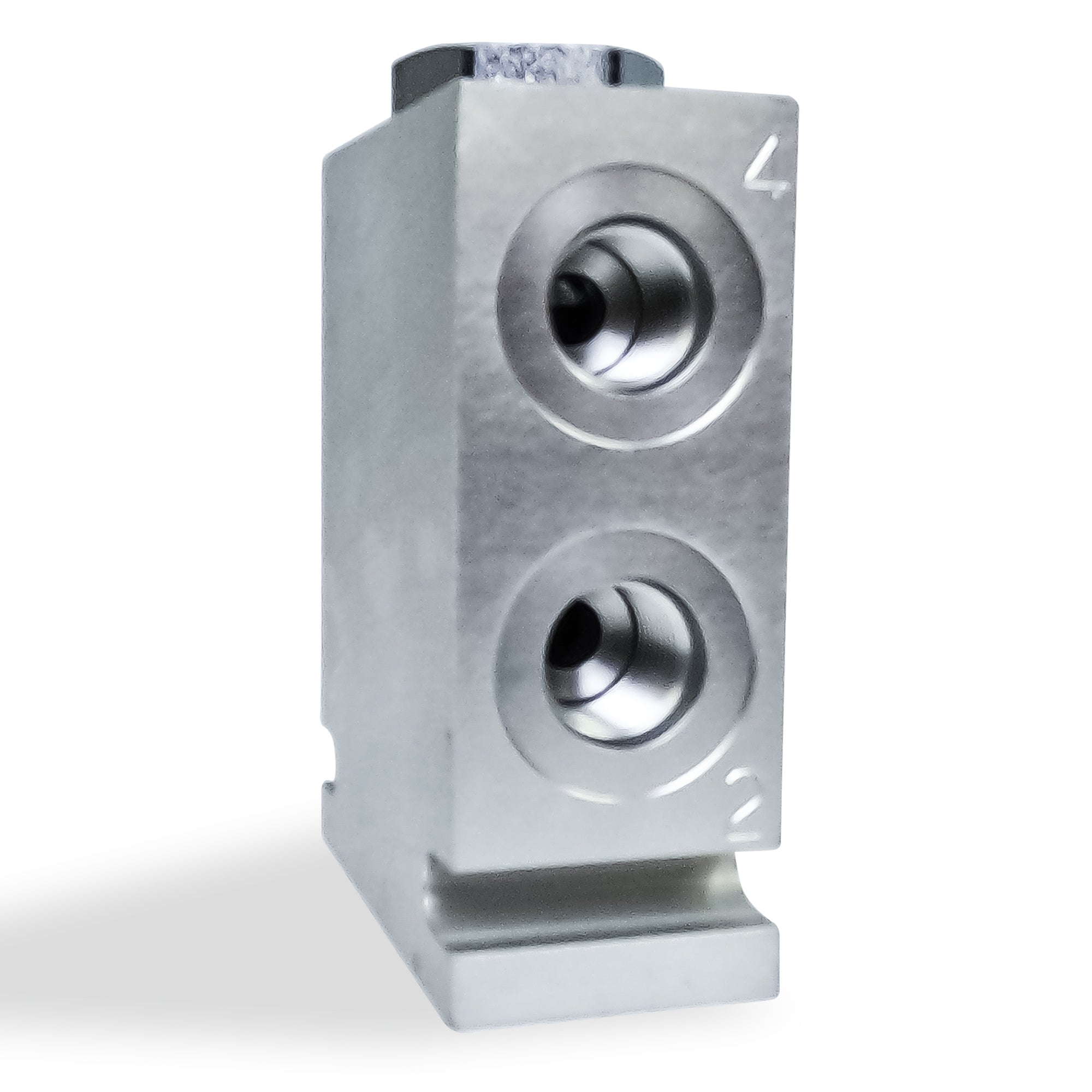 Hydraulic Pump Flow Divider: Close-up of a silver, perforated metal object, essential for synchronizing and balancing dual-acting hydraulic cylinders in high-pressure systems.